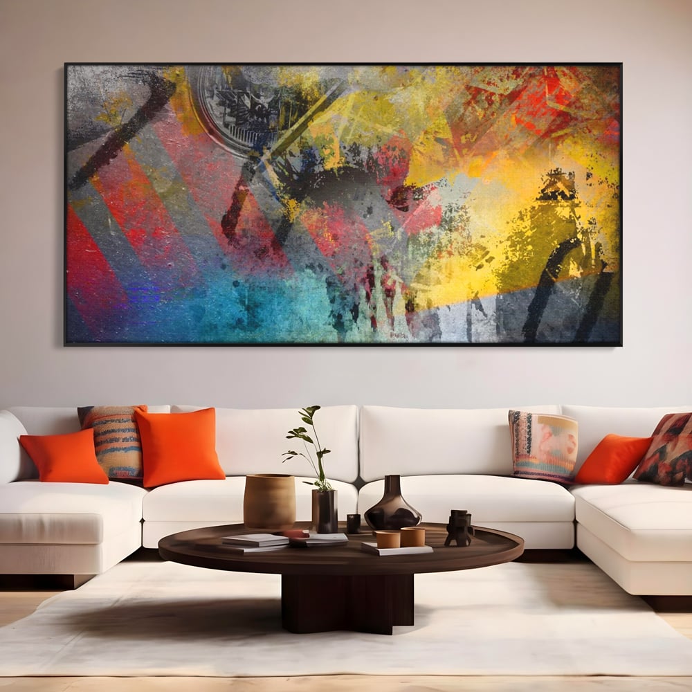 Tablou canvas cu pictura abstracta cu pete vibrante, in rama de aluminiu negru, pe perete intr-un living